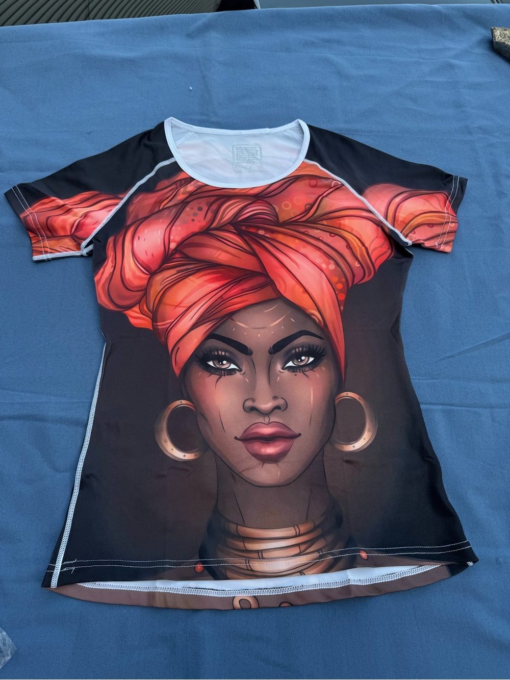 Women’s Graphic Short-Sleeve Top with Orange Headwrap Design